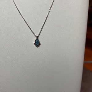 Mini hamsa with light blue stone